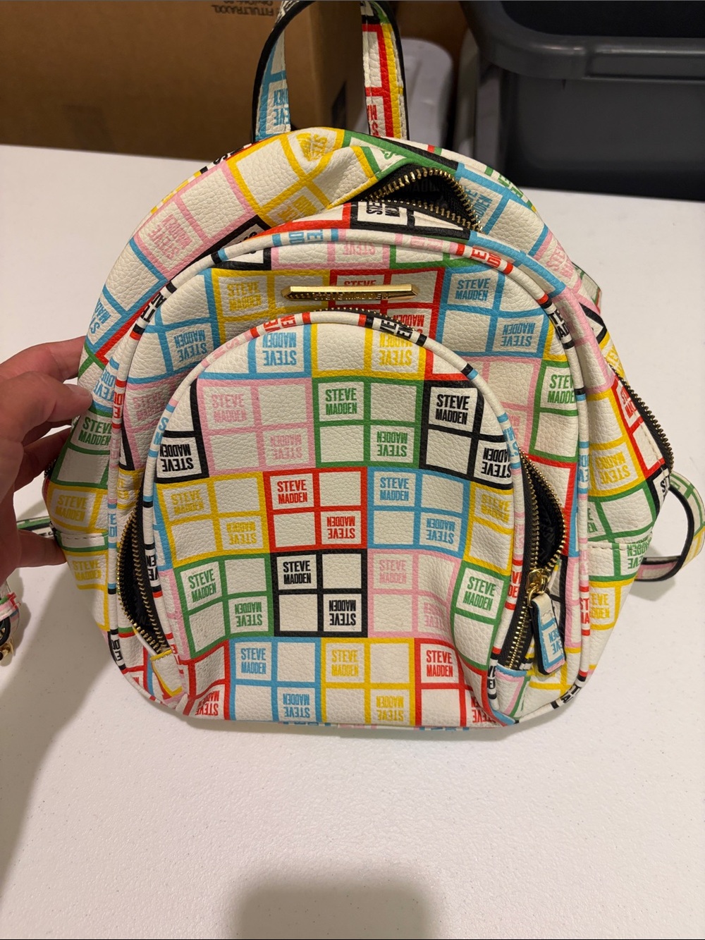 Steve Madden White Mini Backpack with Multicolor Logo Grid